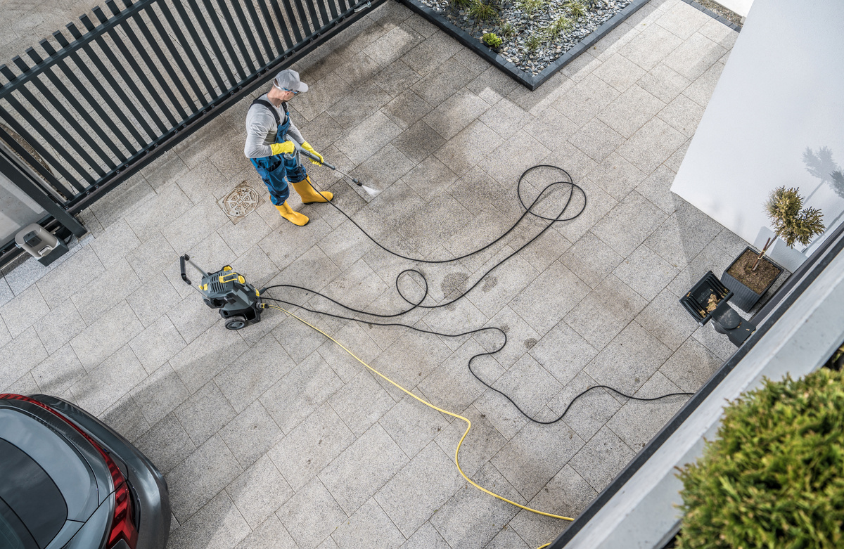 Home Owner Pressure Washing His  Driveway